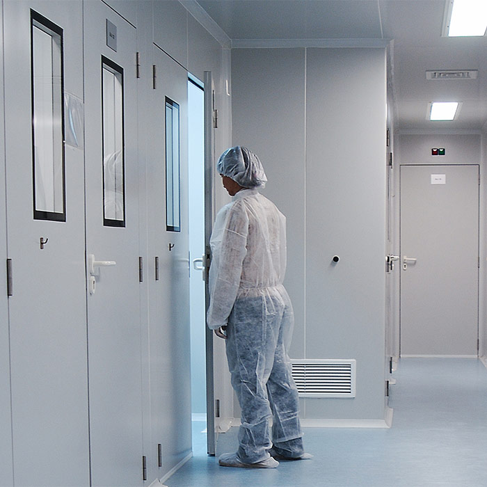 Scientist going into a room in a laboratory